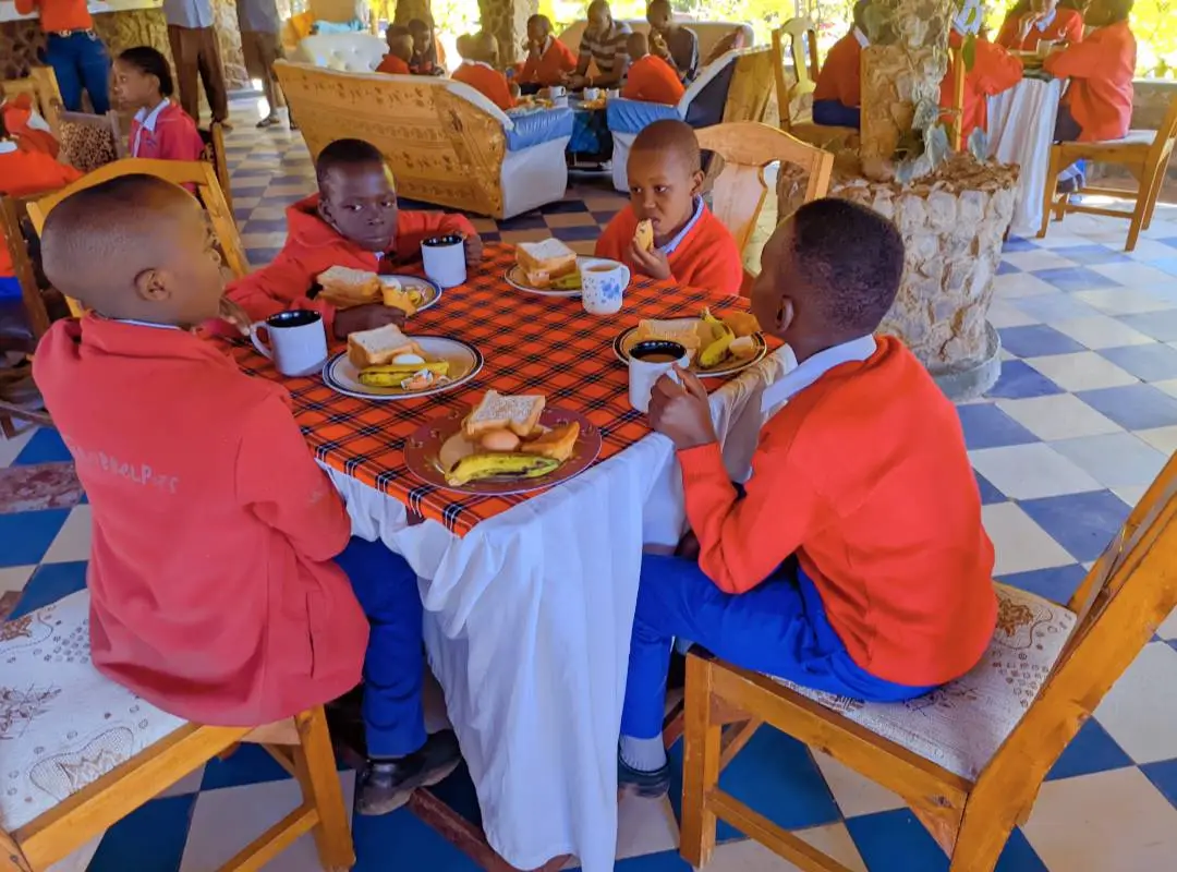 Neema Academy pupils enjoyin breakfast